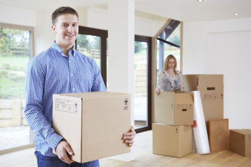 Packed household boxes and furniture ready for removal