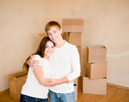 Removal worker reviewing a safe moving checklist and equipment