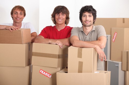 Local team collecting furniture from a flat in Archway with narrow access