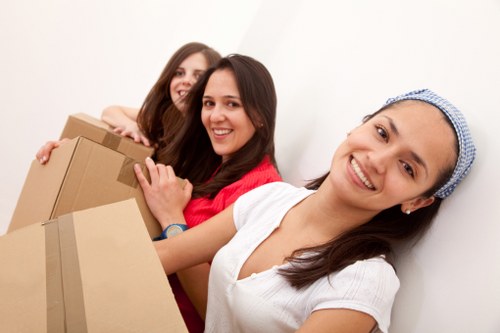 Team handling furniture during a home move in North London