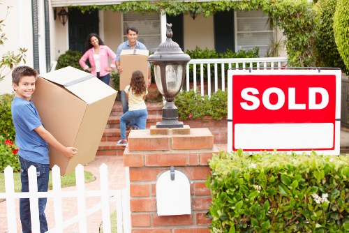 Packed boxes and furniture ready for loading by a local removal company