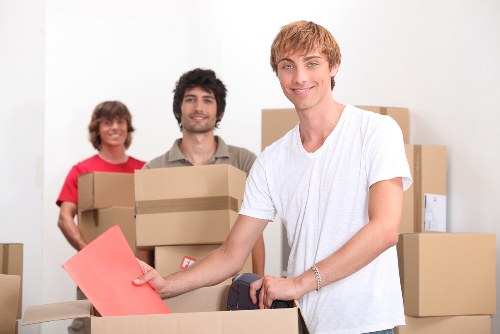 Packed moving boxes ready for transport from an Archway home